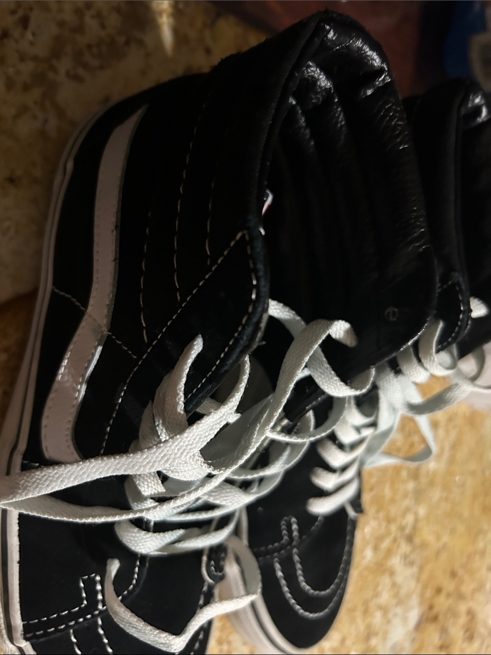 Vans  women’s Black and White High-Top Skate Sneakers